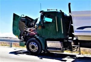 front end of a semi-truck with damage after being involved in an accident
