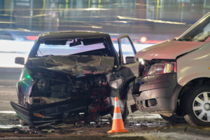 damaged cars sitting in the road after an accident