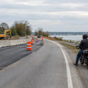 Motorcycle accident construction zone Maryland scene with temporary barriers and a rider observing safely