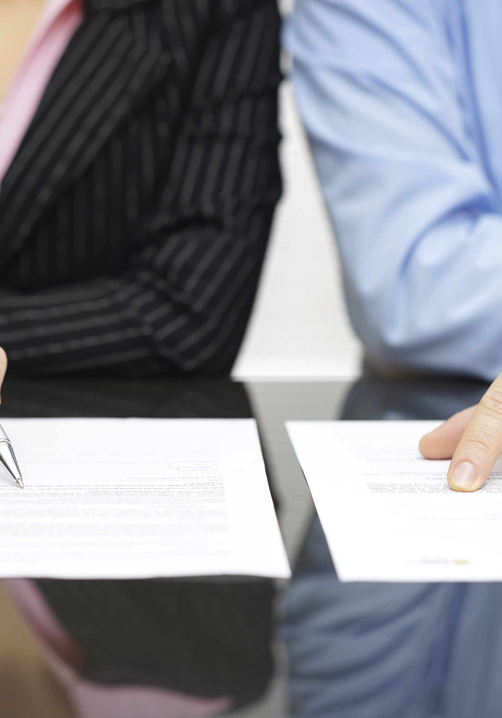 businessman and businesswoman are inspecting contract